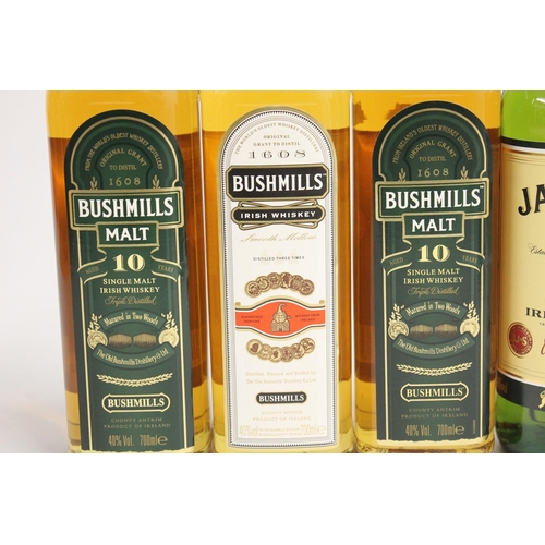 339 - Five bottles of Irish whisky including two bottles of BUSHMILLS Malt 10 year old single malt whiskey... 