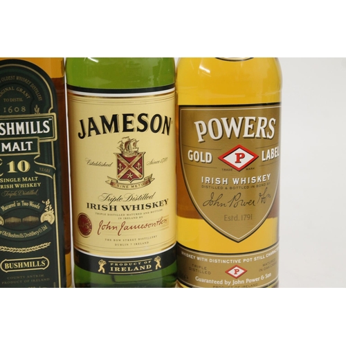 339 - Five bottles of Irish whisky including two bottles of BUSHMILLS Malt 10 year old single malt whiskey... 