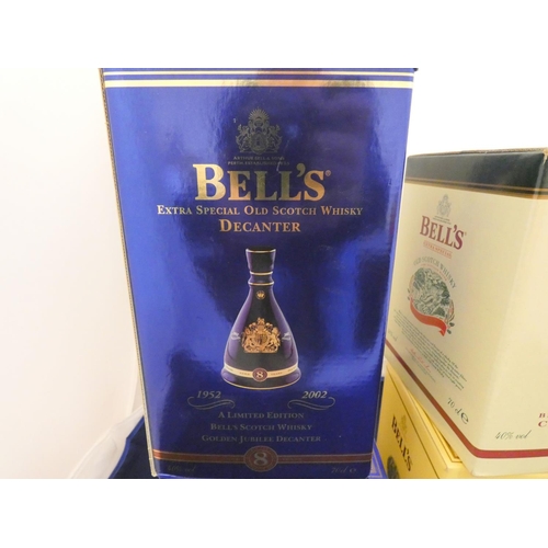 38 - Three Bell's old scotch whisky Christmas limited edition decanters with contents, Dated 1998, 2004, ... 