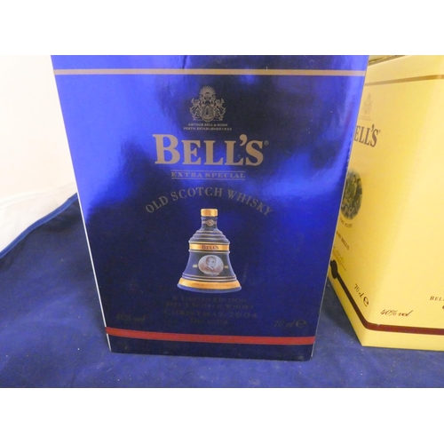 38 - Three Bell's old scotch whisky Christmas limited edition decanters with contents, Dated 1998, 2004, ... 