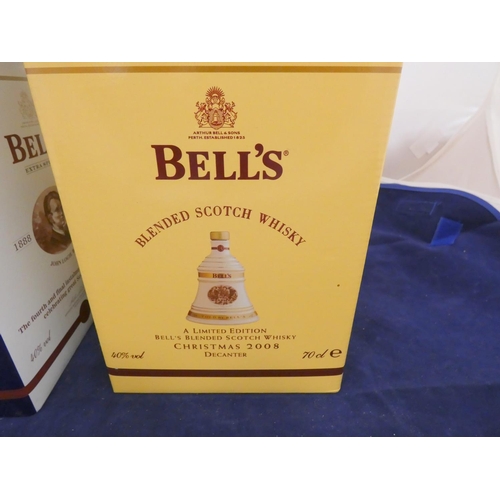 38 - Three Bell's old scotch whisky Christmas limited edition decanters with contents, Dated 1998, 2004, ... 