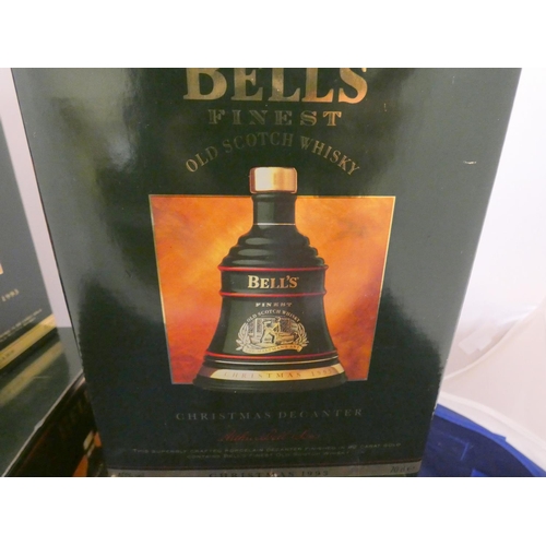 40 - Four Bell's finest old scotch whisky Christmas decanters with contents, Dated 1992, 1994, 1995, all ... 