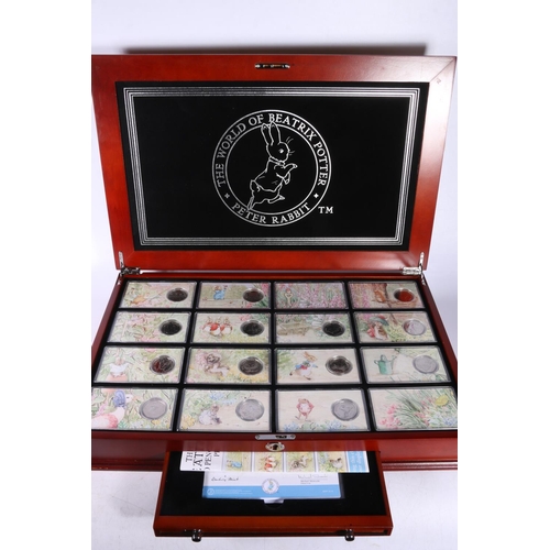 608 - The Danbury Mint The World of Beatrix Potter fifty pence collection comprising fourteen 50p coins, e... 