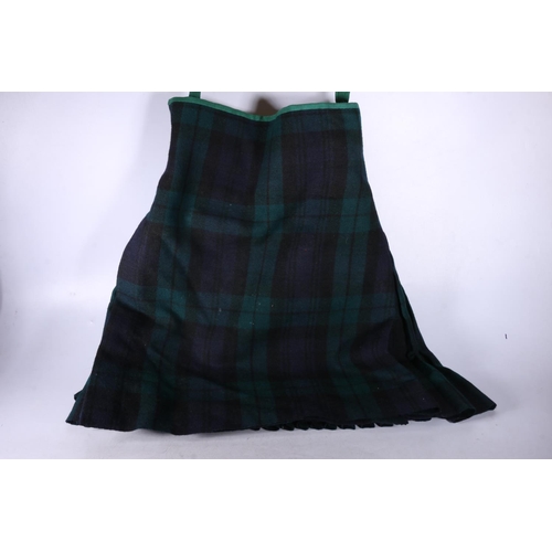 815 - Black Watch tartan kilt with military markings to the interior. 