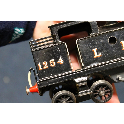 110 - O gauge model railways to include 0-6-2 locomotive 7789 LMS black and 0-4-0 clockwork locomotive 125... 