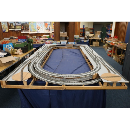 208 - Large two level model railway layout, made from four joining boards, also building, rail and other a... 