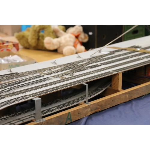 208 - Large two level model railway layout, made from four joining boards, also building, rail and other a... 