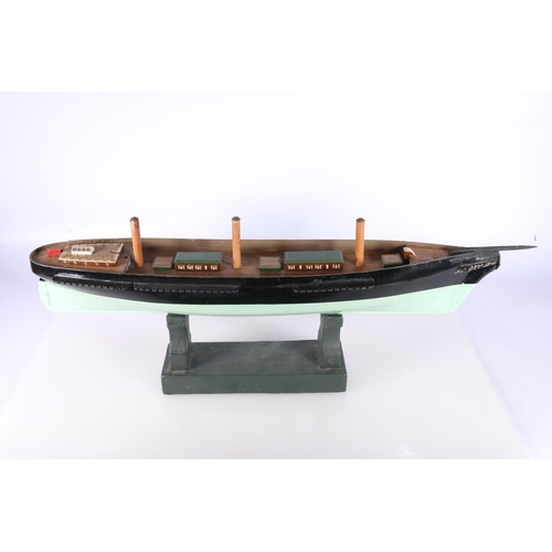 223 - Model ship hull 'Ariel' raided on wooden plinth, 58cm long.