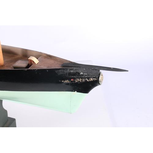 223 - Model ship hull 'Ariel' raided on wooden plinth, 58cm long.