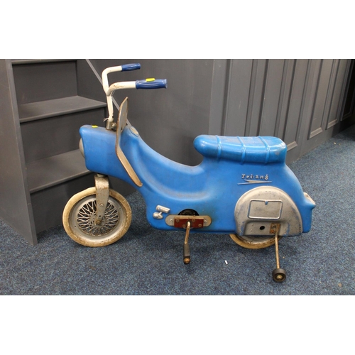 238 - Child's ride on peddle bike by Triang, 95cm long.