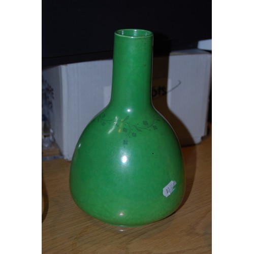 220 - Two Ruskin Pottery vases, one with colourful drip decoration, 15cm high, the other of bottle shape o... 