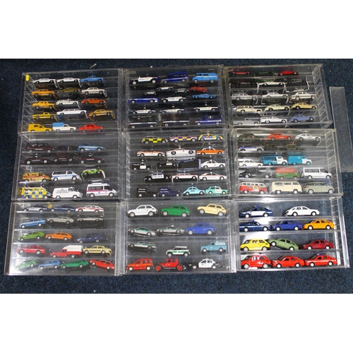 195 - Large collection of diecast emergency and other vehicles held in perspex cases, makers including Lle... 