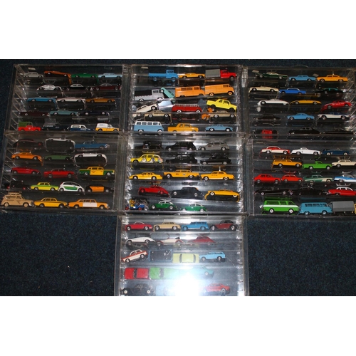 196 - Large collection of model vehicles held in perspex cases, makers including Amercom, Oxford, Vanguard... 