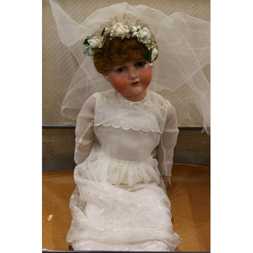 272 - Bergmann of Waltershausen large bisque head sleepy eye doll in wedding dress and wearing wreath, the... 