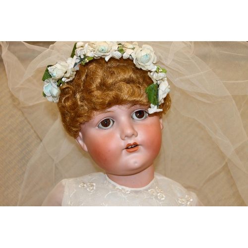 272 - Bergmann of Waltershausen large bisque head sleepy eye doll in wedding dress and wearing wreath, the... 