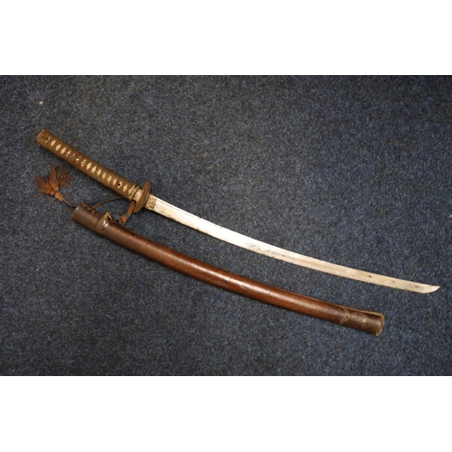 785 - Japanese katana sword having curving 68cm long blade, iron tsuba, gilded fuchi, the tang not accessi... 