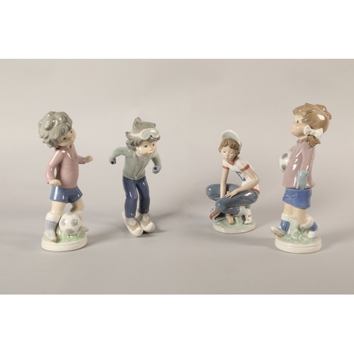 38 - Four Lladro figures, including boy & girl playing football (4).