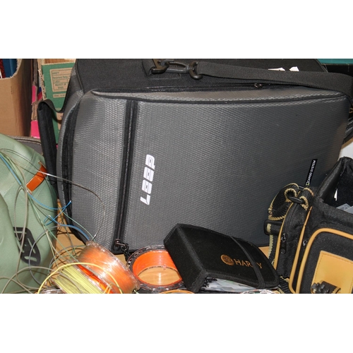 414 - Loop Cargo System fishing tackle bag, a Fishpond tackle bag containing spools and line and another. ... 