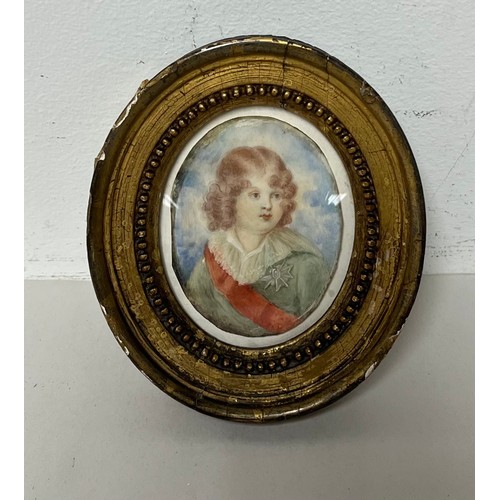 183 - Miniature portrait of a girl in oval gilt frame.