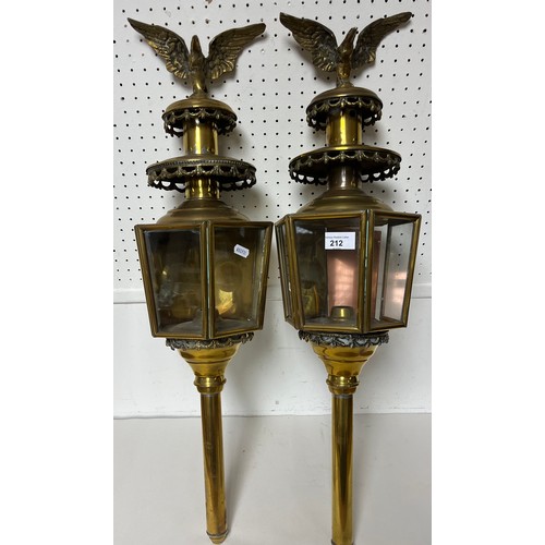 212 - Pair of brass carriage lamps with eagle finials.