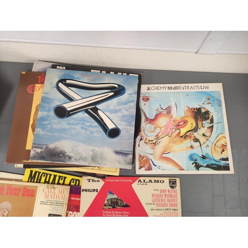 414 - Large collection of records and singles to include Santana Fantasy, Mike Oldfield Tubular Bells, Dir... 