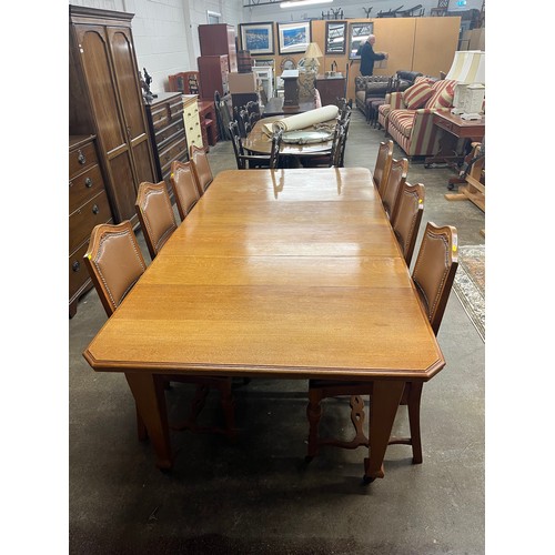 502 - 19th century light oak telescope dining table with two leaves, eight chairs & matching sideboard