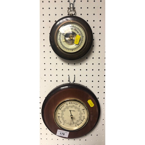 178 - Two round barometers with hardwood surround.