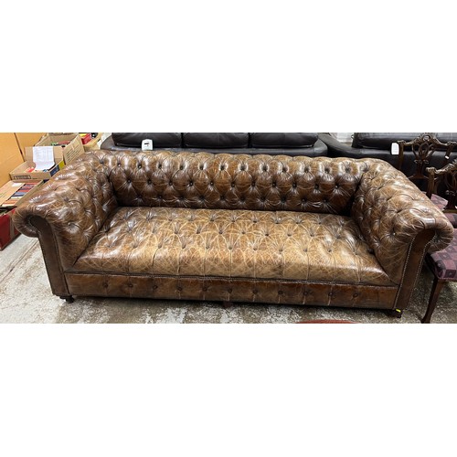 518 - Tan leather three seater chesterfield settee