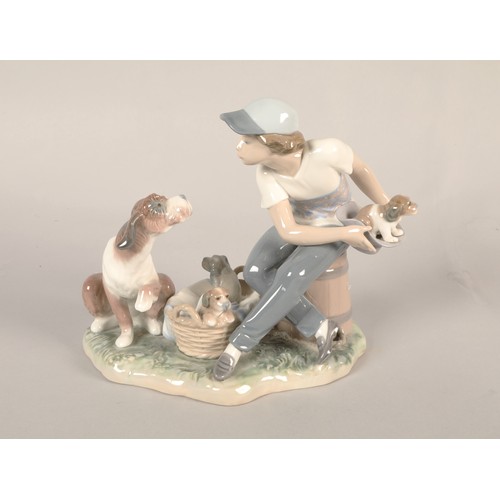 144 - Lladro figure, boy with dogs.