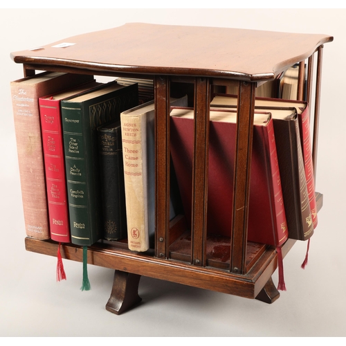 439 - Revolving table top bookcase with assorted books