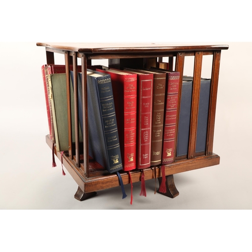 439 - Revolving table top bookcase with assorted books