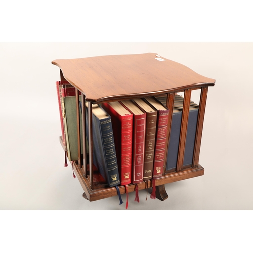 439 - Revolving table top bookcase with assorted books