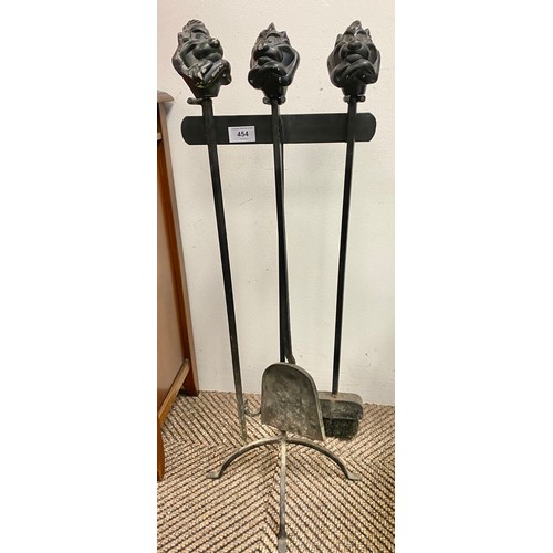 454 - Wrought iron companion stand with tasmanian devil finials