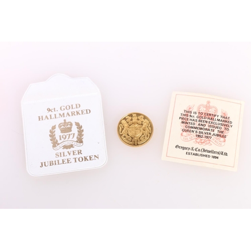 738 - Gregory and Co Jewellery 9ct gold Queen Elizabeth II silver jubilee 9ct gold commemorative medal 197... 