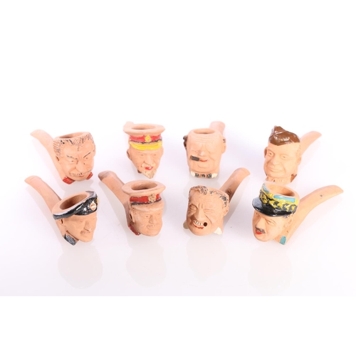 863 - Eight terracotta smoking pipes by Delf modelled as busts of Allied leaders including Churchill, Mont... 