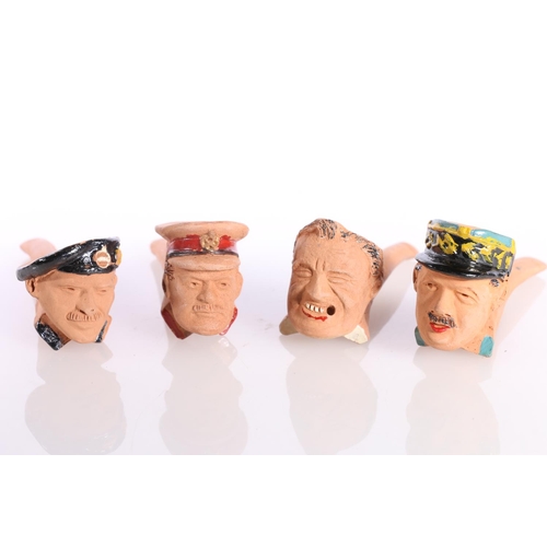 863 - Eight terracotta smoking pipes by Delf modelled as busts of Allied leaders including Churchill, Mont... 