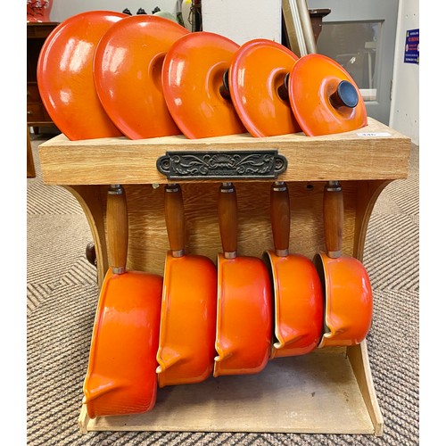 446 - Set of five Le Creuset pots & stand