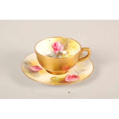 139 - Royal Worcester miniature teacup and saucer with rose design.