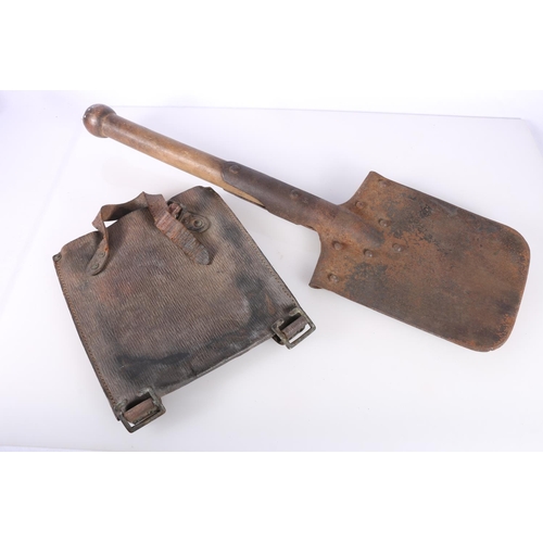 877 - Entrenching spade with leather carrier, 53cm long.