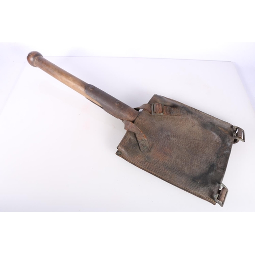 877 - Entrenching spade with leather carrier, 53cm long.