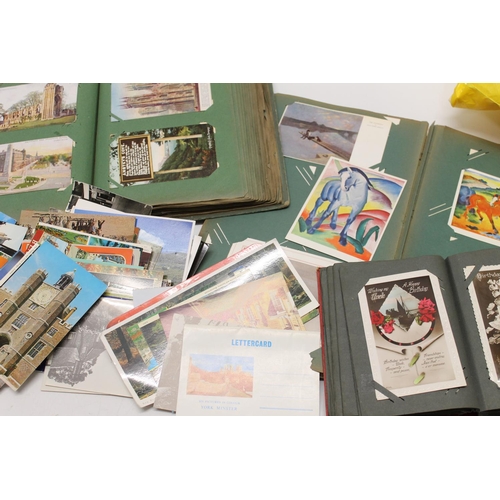 446 - Large postcard collection to include an Art Nouveau album of art card, a Secessionist style album wi... 