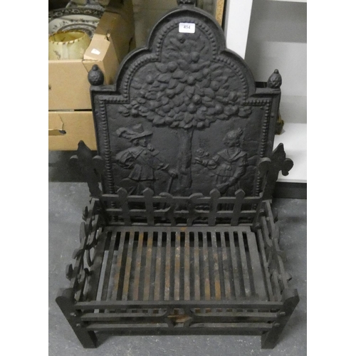 494 - Modern cast iron fire grate and cast black plate.