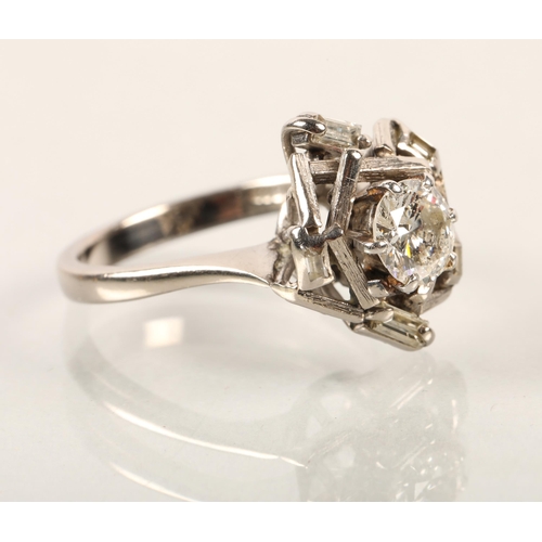 43 - 18 ct white gold diamond solitaire ring surrounded with baguette cut diamonds,  ring size ocentral d... 