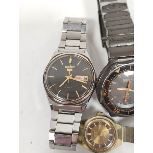 105 - Three Seiko watches to include a Seiko 5 Automatic 6309-8970, a Seiko Quartz Sports 100, and a ladie... 