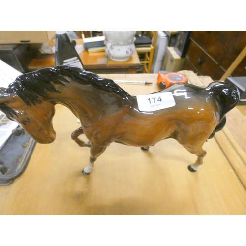 174 - Royal Doulton chestnut horse figure. 19cm high.