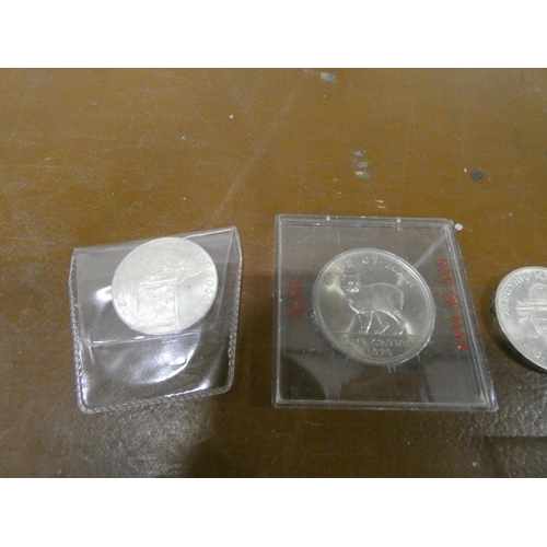 258 - Box of commemorative coins, some silver.