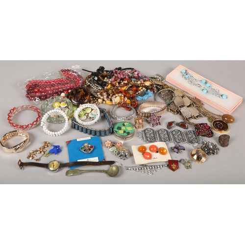 141 - Various items including watches, beads, compact, brooches