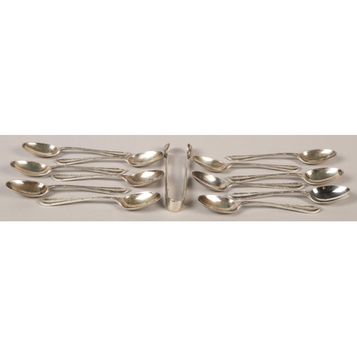 143 - Twelve Walker and Hall silver teaspoons with sugar tongs, Sheffield, 1930 in case