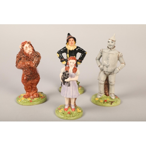 20 - Four Royal Doulton ' The Wizard of Oz' figures, including Dorothy, Lion, Scarecrow, Tinman. (4)