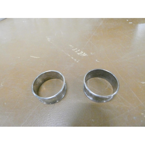 264 - Two silver napkin rings.